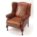 Mahogany framed brown leather wingback armchair, 104cm high : For Further Condition Reports Please