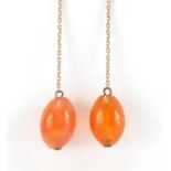 Pair of 9ct gold carnelian drop earrings, 6cm in length, approximate weight 7.2g :For Further