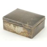 Rectangular silver cigarette box, the hinged lid with engine turned decoration, by William Comyns,