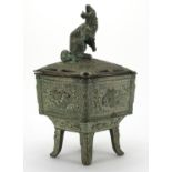 Chinese bronze four footed censer and cover, cast with panels of dragons, character marks to the