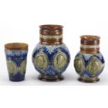 Two Doulton Lambeth Queen Victoria Coronation jugs and a beaker, each with impressed marks to the