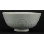 Chinese porcelain Blanc De Chine footed bowl, decorated in low relief with flower heads and roundels