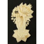 Victorian carved ivory hand holding and rose brooch, 7cm in length, approximate weight 13.0g :For