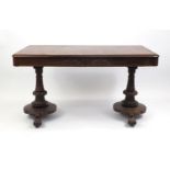 Victorian rosewood library centre table, with a pair of frieze drawers, on turned columns, 75cm H