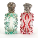 Two Victorian flashed cut glass scent bottles with unmarked silver mounts, one with stopper, the