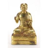 Chino Tibetan gilt bronze figure of a seated Monk, 24.5cm high :For Further Condition Reports Please