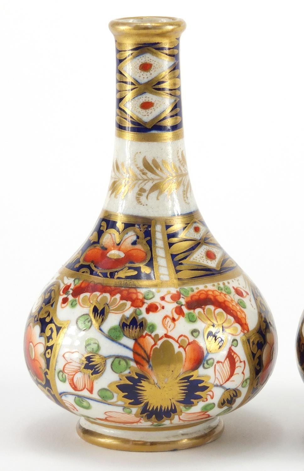 Two 19th century Derby porcelain bottle vases, hand painted and gilded in the Imari palette, painted - Image 2 of 7