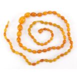 Butterscotch amber colour bead necklace, 60cm in length, approximate weight 11.0g :For Further