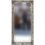 Large rectangular bevelled edge mirror, the silvered frame with applied shell and floral motifs,