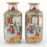 Pair of Chinese Canton porcelain vases, hand painted in the famille rose palette with panels of