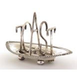 Silver plated Toast design toast rack, in the style of Christopher Dresser, 18cm in length :For