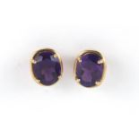 Pair of 9ct gold amethyst earrings, 1cm in length, approximate weight 1.8g : For Further Condition
