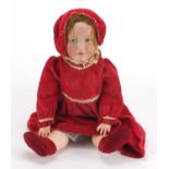 19th century German bisque headed doll, with jointed limbs in traditional dress, impressed KB 109 to