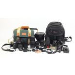 Two Canon camera outfits, Canon T90 and Canon EOS30 bodies with lenses including Tamron, both with