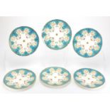 Set of six Victorian Minton's cabinet plates, each hand painted with flowers and foliage within a