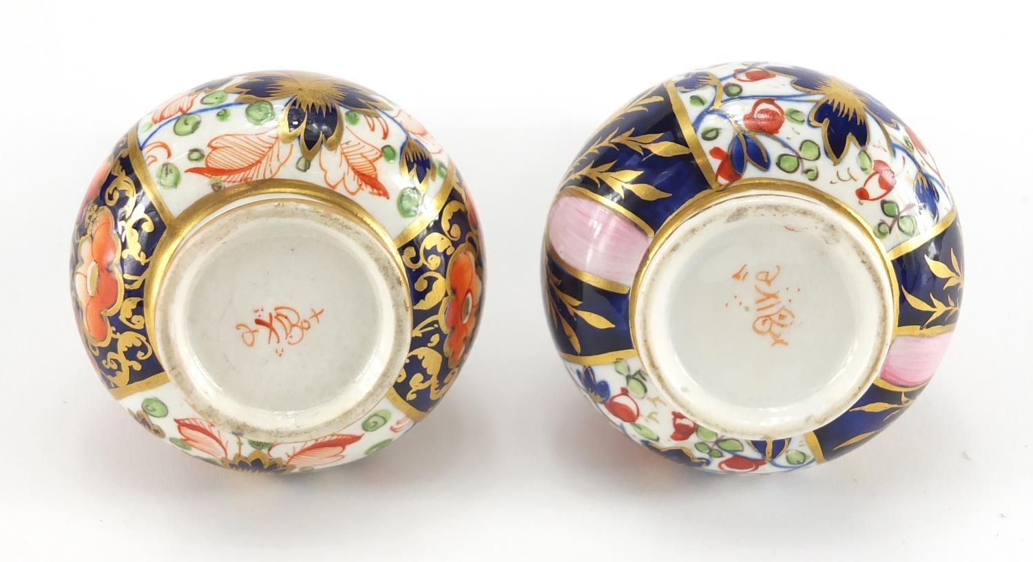 Two 19th century Derby porcelain bottle vases, hand painted and gilded in the Imari palette, painted - Image 5 of 7
