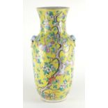Chinese porcelain yellow ground vase, with animalia ring handles, finely hand painted in the famille