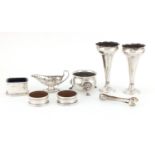 Silver and white metal objects including a pair of bud vases, napkin rings, salts and caviar boat,