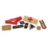 German World War II Insignia including Medic armband, SS collar tab, Panzer collar tab, Werkschutz