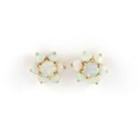 Pair of 9ct gold opal flower head earrings, 9mm in diameter, approximate weight 1.4g :For Further