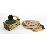 Vintage German tin plate clockwork child's gramophone, with seven records, the gramophone printed