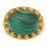 Unmarked gold and malachite brooch with vine design surround, 4cm wide, approximate weight 12.4g :