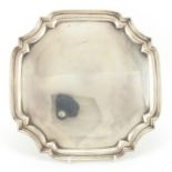 Square silver salver with four scroll feet, by Hamilton & Co, Sheffield 1933, 27cm x 27cm,
