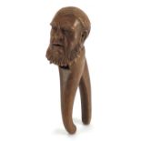 Pair of Black Forest nut crackers carved as a bearded gentleman, 21cm in length :For Further
