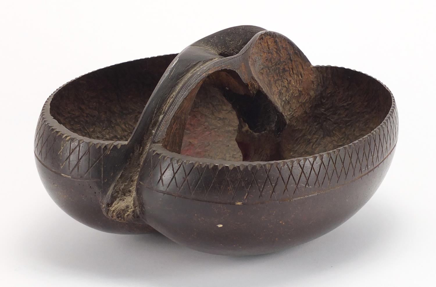 Tribal interest Coco De Mer nut basket, the rim carved with a chevron design, 27cm in length :For - Image 2 of 4