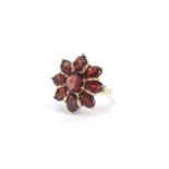 Large 9ct gold red stone flower head ring, size P, approximate weight 5.9g : For Further Condition