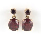 Pair of unmarked gold purple stone drop earrings 1.8cm in length, approximate weight 3.8g :For