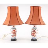 Pair of Chinese porcelain baluster lamps, hand painted with dragons with shades, each 46cm high :