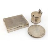 Silver objects comprising circular compact with engine turned decoration, rectangular cigarette case