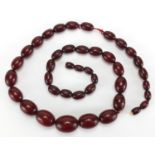 Cherry amber coloured bead necklace, 65cm in length, approximate weight 63.0g :For Further Condition