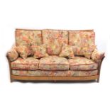 Ercol Renaissance three seater settee, with floral upholstered lift off cushions, approximately