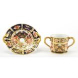 Miniature Royal Crown Derby Imari twin handled loving cup and a saucer, each with factory marks to