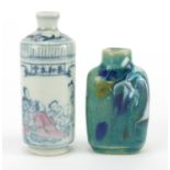 Two Chinese porcelain snuff bottles, including a cylindrical example hand painted with figures in an