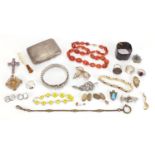 Costume jewellery including a carnelian necklace, brooches, silver rings and a rectangular silver