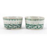 Pair of Chinese porcelain brush washers, hand painted in green and incised with crashing waves,