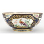 18th century porcelain punch bowl in the style of Worcester, the exterior hand painted with panels