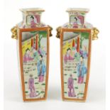 Pair of Chinese Canton flat sided vases with twin gilt head handles, hand painted in the famille