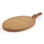 Robert Thompson Mouseman oak cheese board carved with a signature mouse, 38cm in length :For Further