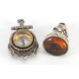 Two silver pendants, including a compass and citrine fob, the largest 3cm in length, approximate