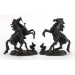 After Guillaume Coustou The Elder - Pair of patinated bronze Marly horses with trainers, the largest