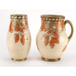 Crown Ducal pottery vase and jug by Charlotte Rhead, each hand painted and tube lined with