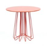 Zanotta Smallwire side table designed by Levy Arik, with circular rotating glass top in orange,