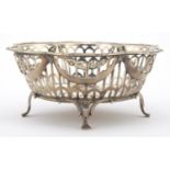 Circular silver four footed bon bon dish with pierced decoration and floral swags, by S & Co,