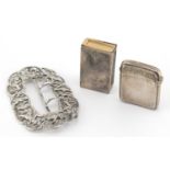 Silver objects comprising a Victorian buckle with cherubs and swans, rectangular vesta and