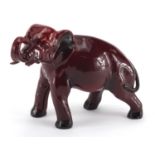 Royal Doulton Flambe elephant, factory marks to the underside, 14cm high x 19cm in length :For