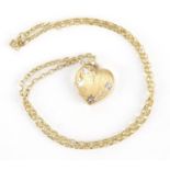 9ct gold love heart locket on a 9ct gold necklace, approximate weight 7.8g : For Further Condition